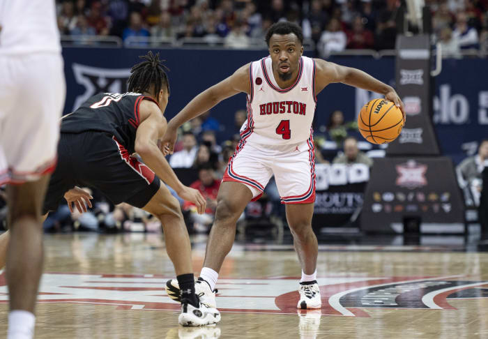 Mar 15, 2024; Kansas City, MO, USA; Houston Cougars guard LJ Cryer (4) controls the ball while defended by Texas Tech Red Raiders guard Chance McMillian (0) in the second half at T-Mobile Center.